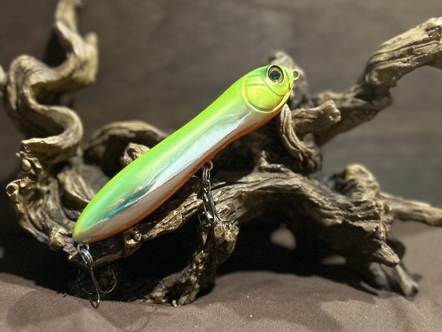 Custom airbrushed 5.25-inch peanut style topwater lure in Blacklight Special