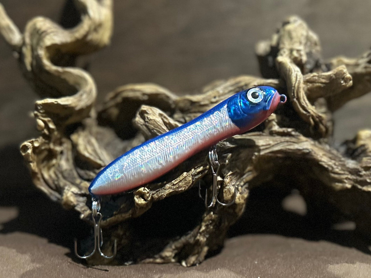 Custom airbrushed 4.0-inch peanut style topwater lure in Flounder Finger