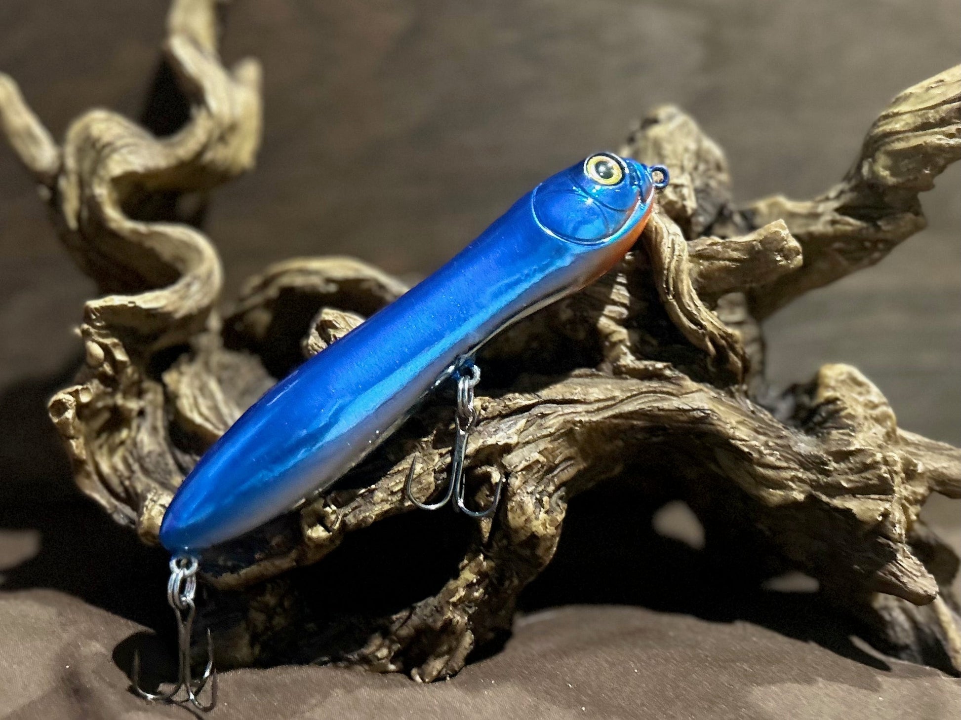 Custom airbrushed 5.25-inch peanut style topwater lure in Little Blue Pill